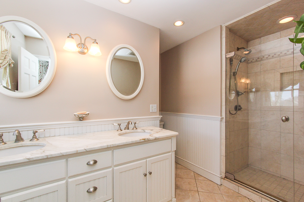bathroom with double sinks shower with glass doors 140 Bridge Street Hamilton Massachusetts