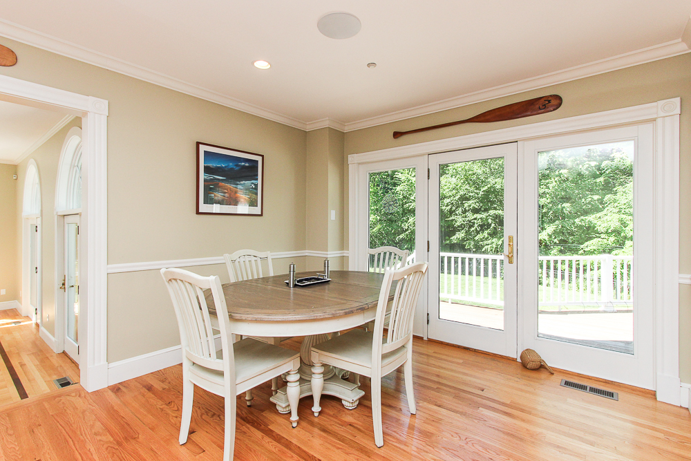 Kitchen dining area with hardwood floors and door to the deck 8 Gussett Road Wenham Massachusetts