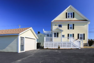 Rear view of house and garage at 496 Cabot Street Beverly MA