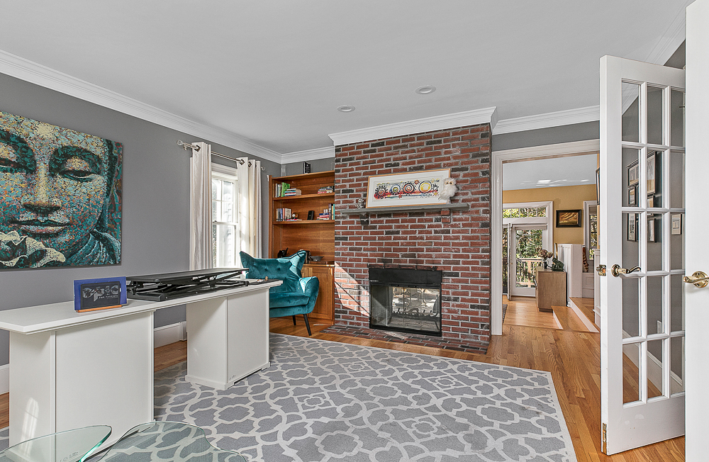 Living roo with fireplace and french doors 376 Highland Street Hamilton Massachusetts
