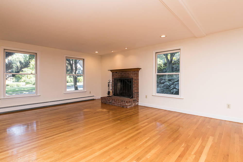 Living room with fireplace and hardwood floors 29 Middlebury Lane Beverly Massachusetts