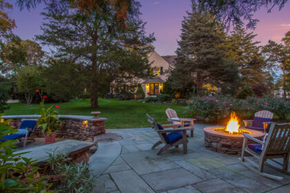 Twilight fire pit, patio and house 1 Monument Street Wenham Massachusetts