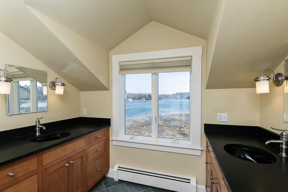 Primary Bathroom with two sinks and water views 17 Stanwood Point Gloucester Massachusetts