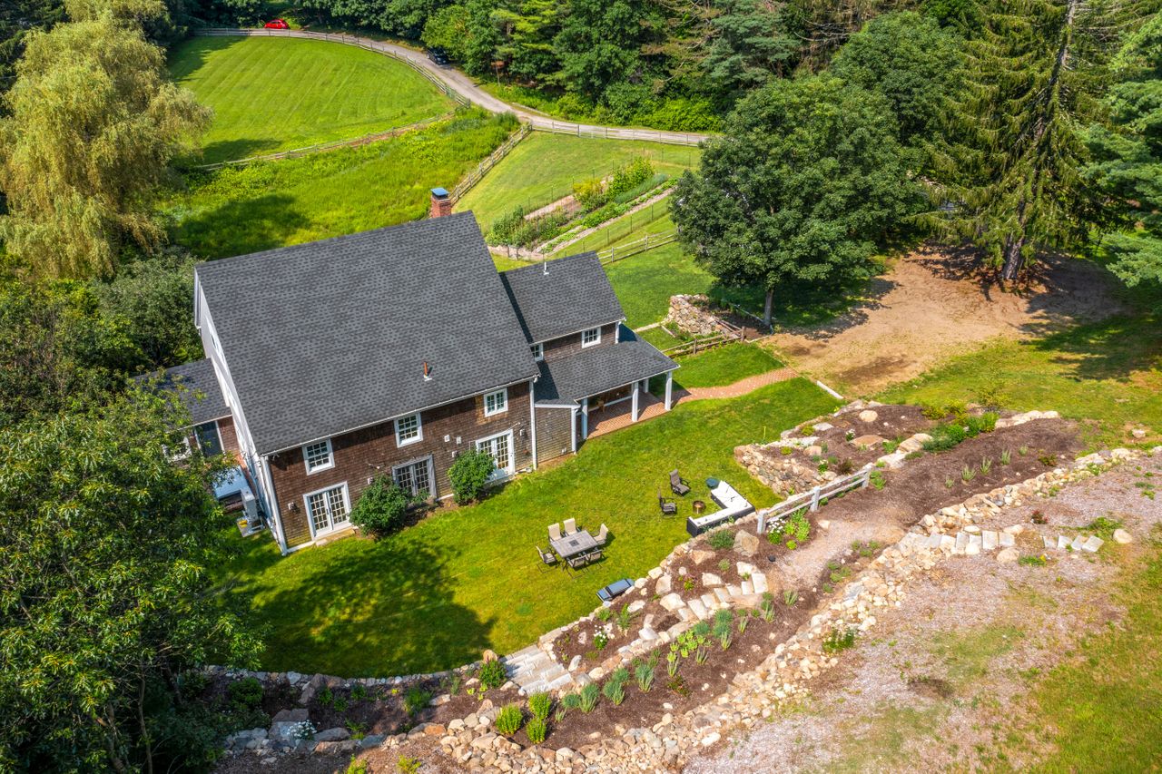 Aerial from the top of the terraced gardens looking at the rear of the house 235 Larch Row Wenham MA