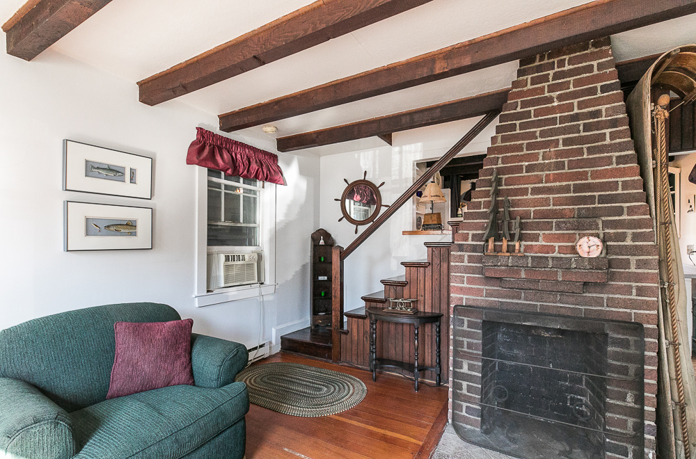 Living room with fireplace at 14 Middle Road Rockport MA
